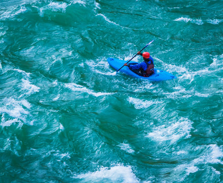 top view of Whitewater kayaking, extreme kayaking. A guy in a kayak sails on a mountain river Ganges in Rishikesh,  India   - Image
