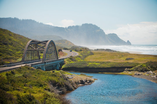 A bridge crosses over Big Creek along Route 101 that parallels the Oregon Coastline, USA.