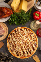 Pizza with bacon and chicken with barbecue sauce