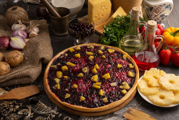 Sweet pizza with berries and pineapple