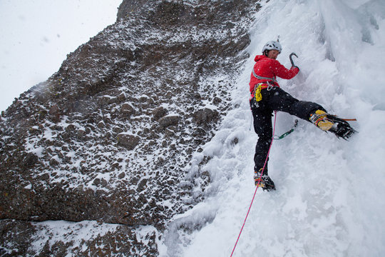 Zach Fletcher ice climbing in wintery conditions at Red Cliffs in Kirkwood, California.