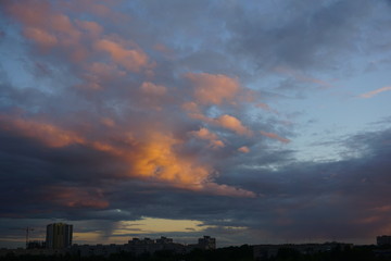 evening view at the city with clouds