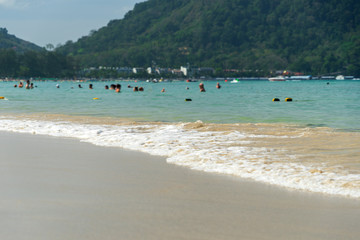 Fototapeta na wymiar Andaman Sea. Relaxing on the beach on a happy sunny day. Image out of focus.