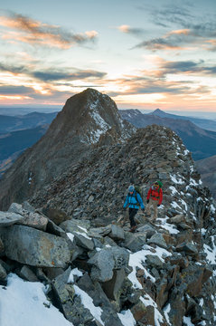 Man and woman mountaineering on the Wilson El Diente Traverse near Tellride, Colorado.