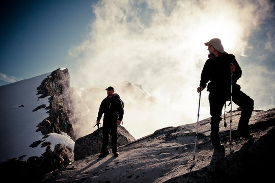 Two climbers in the mountains near Grainger Peak, BC, Canada.