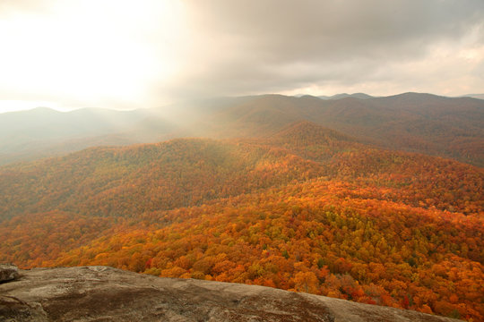 Sunrays and fall colors from the summit of Looking Glass Rock, NC.