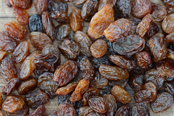 group of raisins on wooden table