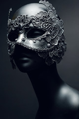 Black head of mannequin in creative metal mask with jewels