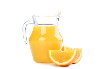 Orange fruit and jug of juice isolated on white background