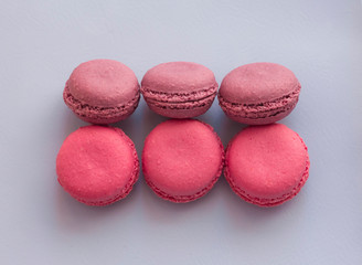 pink almond cookies on a delicate lilac background