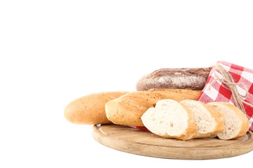Fresh baguettes with red napkin isolated on white background