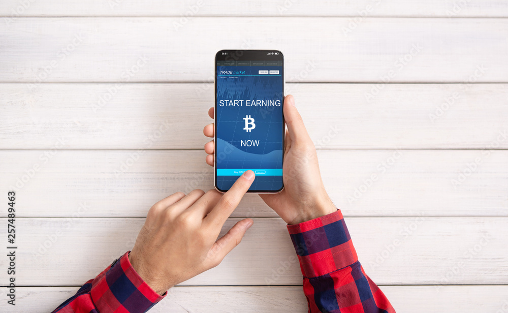 Aufkleber man using bitcoin earning application on smartphone