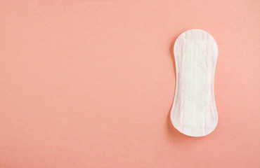 women intimate hygiene products - sanitary pads and tampon on pink background