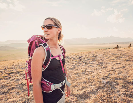 Woman hiking in meadow, Curtis Canyon, near Jackson Hole, Wyoming, USA