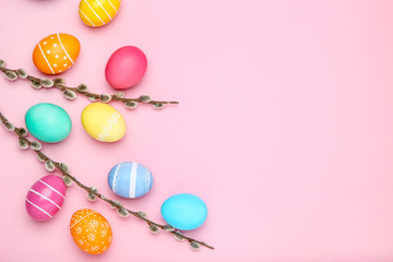 Colorful easter eggs with willow branches on pink background - obrazy, fototapety, plakaty