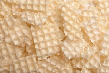 Tasty crushed wafers as background, closeup. Crispy food