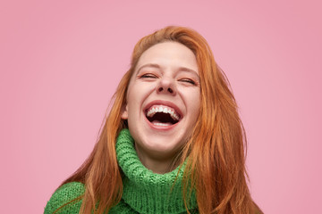 Wonderful laughing girl on pink background