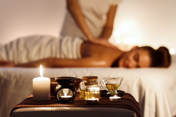 Relaxed woman enjoying aromatherapy massage in luxury spa - obrazy, fototapety, plakaty