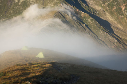 Camping tents in Fagaras Mountains at sunrise, Sibiu, Transylvania, Romania