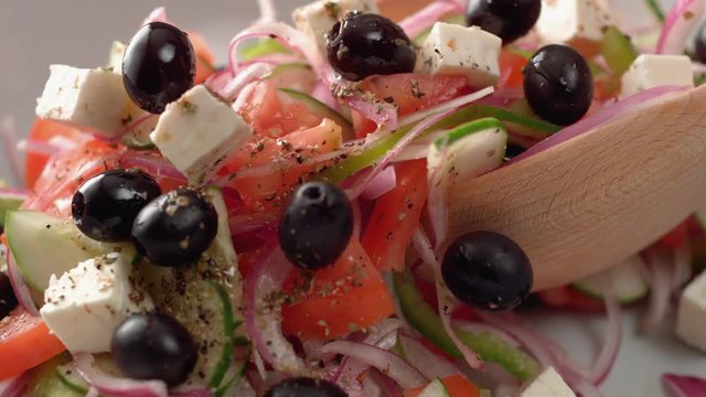 Camera follows tossing greek salad. Shot with high speed camera, phantom flex 4K. Slow Motion.