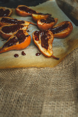 pear baked on butter with cinnamon and sugar spread with hot dark chocolate
