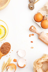 A set of kitchen items for baking sweet flour products. Flour, eggs and other ingredients. Top view. Copy space.