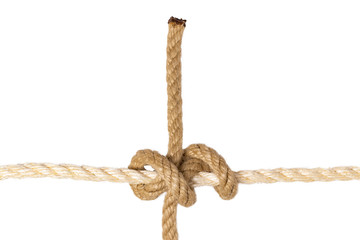 Rope isolated. Closeup of figure rolling hitch node or knot from a brown rope isolated on a white...