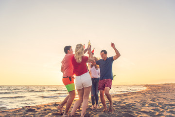 Group of friends enjoy on the beach