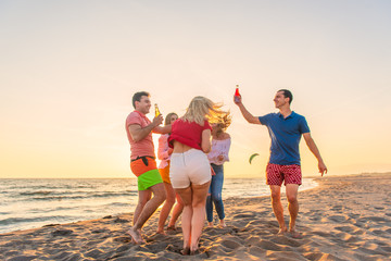 Group of friends enjoy on the beach