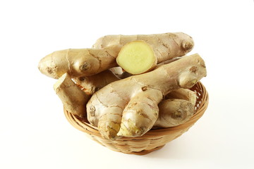 Fresh ginger root spice with slice isolated on white background