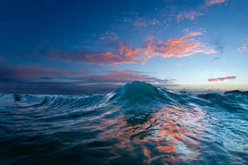 An Ocean Wave In The Early Morning Light On The East Side Of Oahu