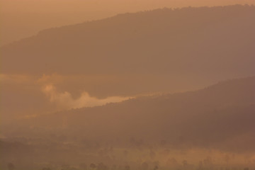 Fototapeta premium scenery during sunrise time with mountain and savannah field