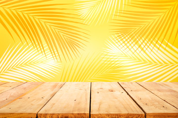 Summer and nature product display with wood table counter on blur coconut leaf background