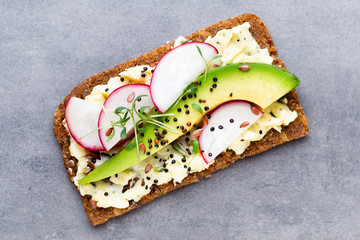 Sandwiches with cream cheese, vegetables and salami.