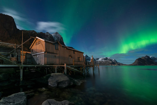 Northern Lights, Aurora Borealis shining over coast at night