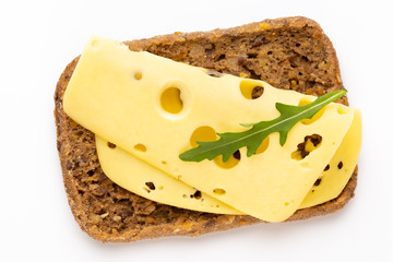 Sandwich with lettuce, cheese on white background.