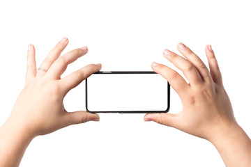 Female hands holding mobile smart phone isolated on white background. Blank white screen. Concept of selfie making photo