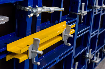Close-up of modular steel frame formwork.