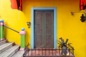 door in yellow wall