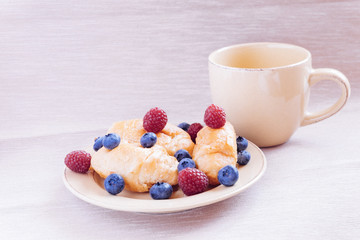 fresh juicy summer berries raspberry and blueberry with drops of honey in a natural beige cotton cloth. 