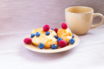 fresh juicy summer berries raspberry and blueberry with drops of honey in a natural beige cotton cloth. 