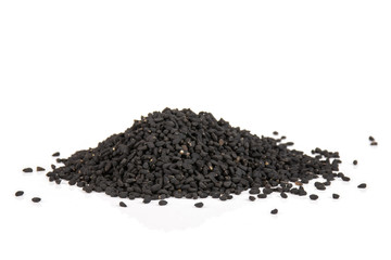 Lot of whole dry black cumin seeds isolated on white background
