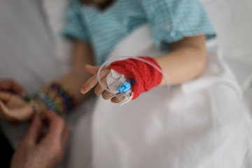 Details with a cannula on the hand of a ill little girl