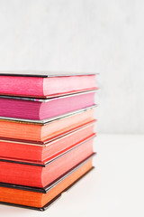 Pile of books with color stack on white background. Copy space