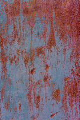 Grungy peeling silver, midnight blue and rosy brown painted rough wall texture with scratches