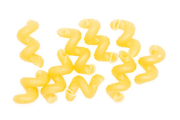 Closeup lot of whole pasta cavatappi flatlay isolated on white background