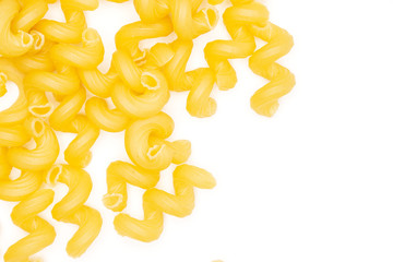 Lot of whole pasta cavatappi copyspace flatlay isolated on white background