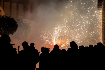 Fototapeta na wymiar The correfocs is a typical Catalan celebration in which dragons with fireworks dance through the streets.