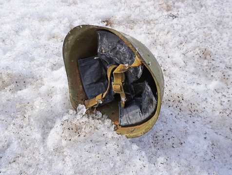 soldier's helmet lying on the snow