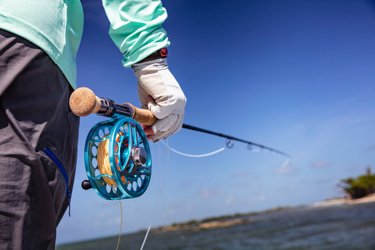 Fly Fishermann holding a rod in his hand, ready to fish. Cuba